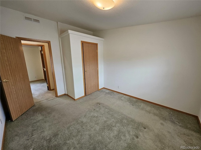 631 Arrowhead Dr, Jefferson, CO 80456 - unfurnished bedroom featuring carpet flooring, a closet, and baseboards