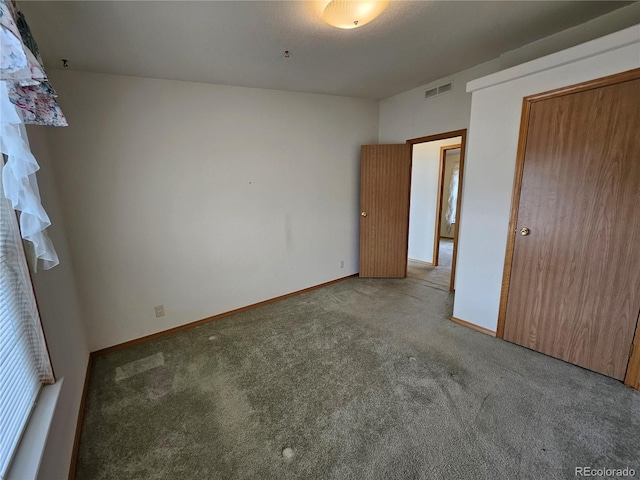 631 Arrowhead Dr, Jefferson, CO 80456 - unfurnished bedroom with carpet floors and baseboards