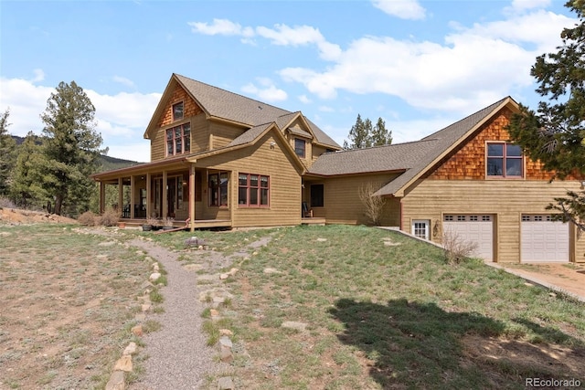 582 Buddy Rd, Bailey, CO 80421 - view of front of house with driveway, a front yard, and a garage