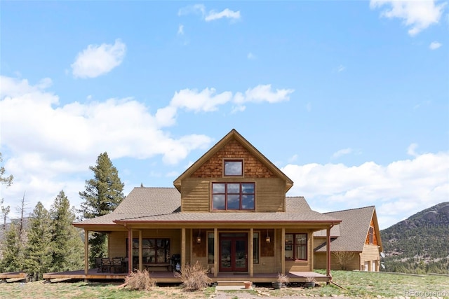 582 Buddy Rd, Bailey, CO 80421 - back of property with a porch, a mountain view, and roof with shingles