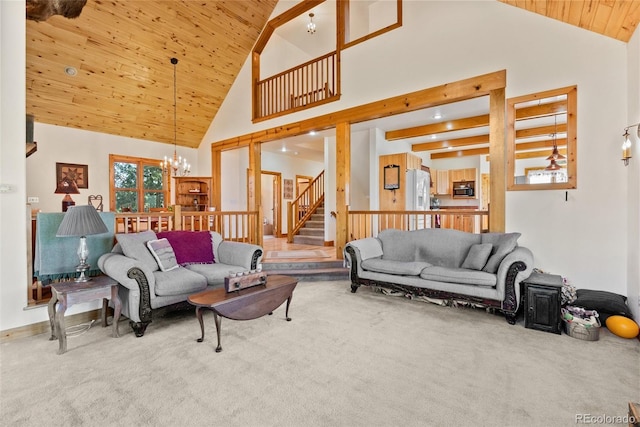 582 Buddy Rd, Bailey, CO 80421 - carpeted living room featuring high vaulted ceiling, a chandelier, wood ceiling, and stairway