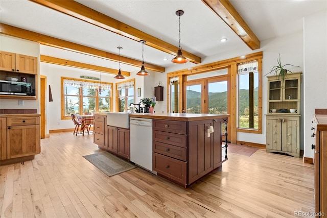 582 Buddy Rd, Bailey, CO 80421 - kitchen featuring white dishwasher, stainless steel microwave, baseboards, and light wood-type flooring