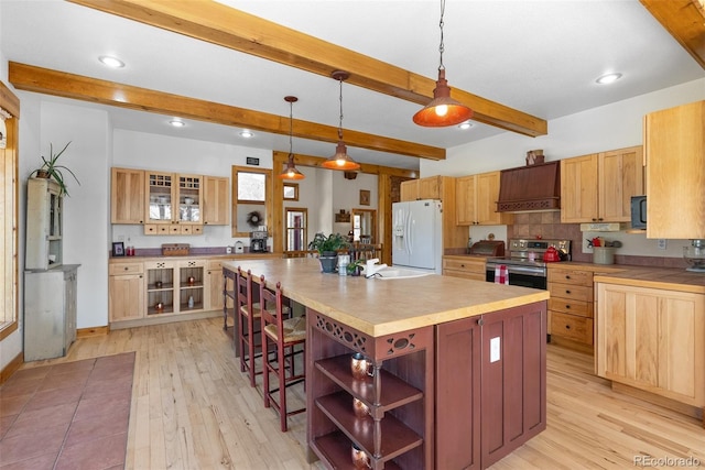 582 Buddy Rd, Bailey, CO 80421 - kitchen featuring stainless steel electric range oven, open shelves, white refrigerator with ice dispenser, light wood finished floors, and custom range hood