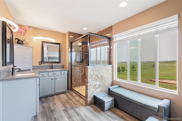11960 Conestoga Trl, Elbert, CO 80106 - full bathroom featuring vanity, a stall shower, wood finished floors, and recessed lighting