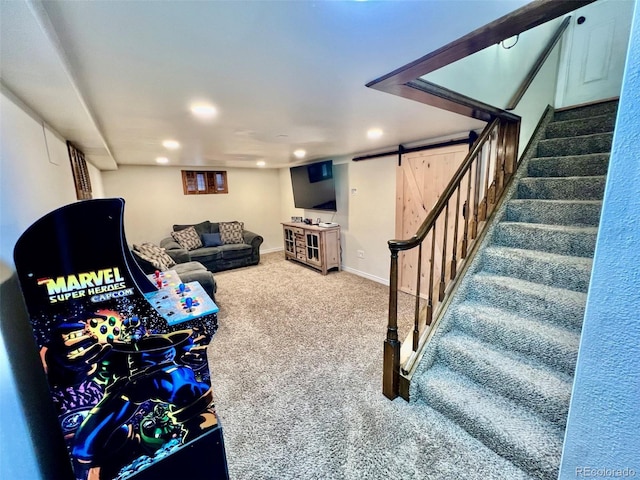 living room with carpet flooring, a barn door, recessed lighting, baseboards, and stairway