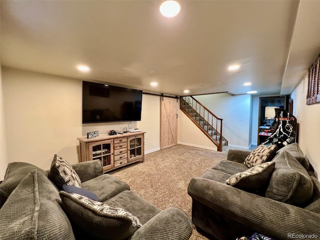 carpeted living area with baseboards, recessed lighting, a barn door, and stairs