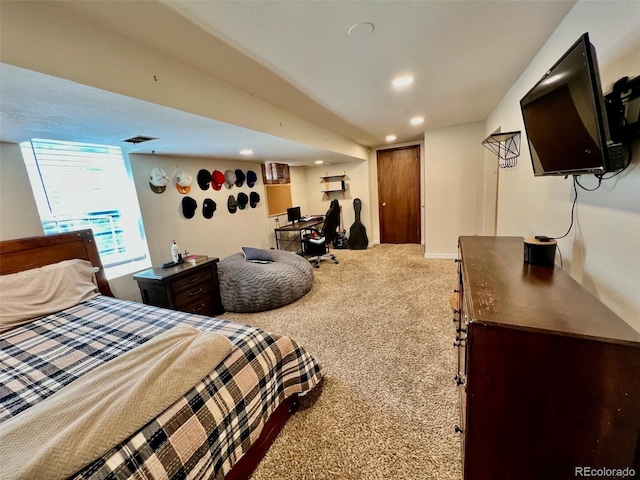 carpeted bedroom featuring recessed lighting