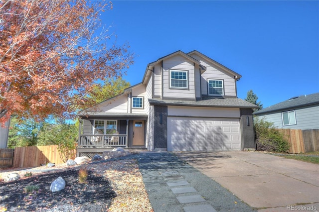 view of front of home with a porch and a garage