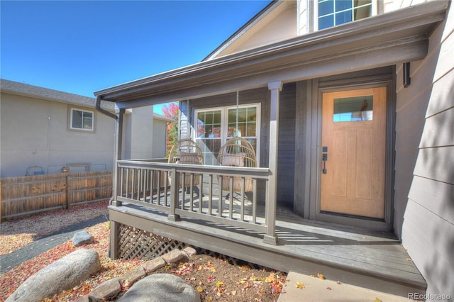 property entrance featuring a porch