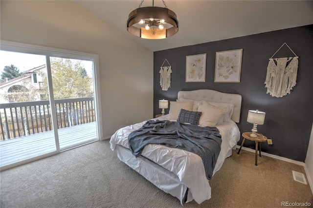 carpeted bedroom featuring access to exterior, an inviting chandelier, and vaulted ceiling