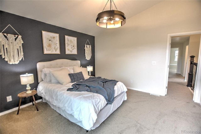 bedroom with carpet flooring and lofted ceiling