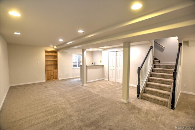 basement featuring carpet floors