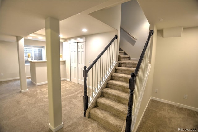 basement featuring light colored carpet