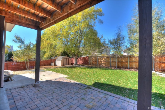 view of patio featuring a storage unit