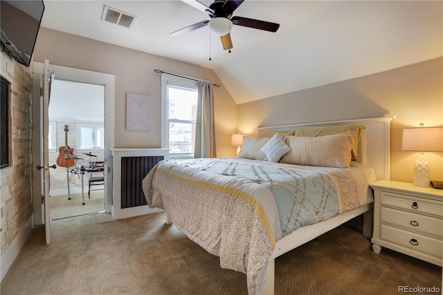 carpeted bedroom featuring vaulted ceiling and ceiling fan