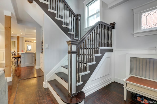 stairs featuring hardwood / wood-style flooring