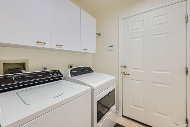 laundry area featuring independent washer and dryer and cabinets