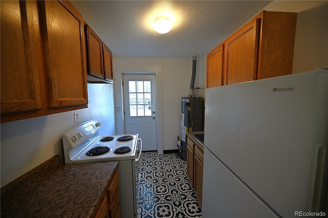 kitchen featuring water heater and white appliances