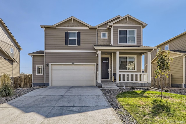 craftsman inspired home with a front yard, a garage, and a porch