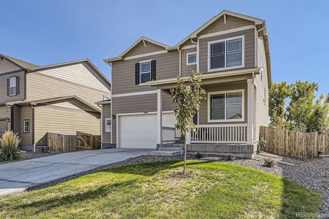 view of front of property with a garage and a front lawn