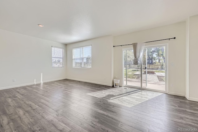 unfurnished room featuring hardwood / wood-style flooring