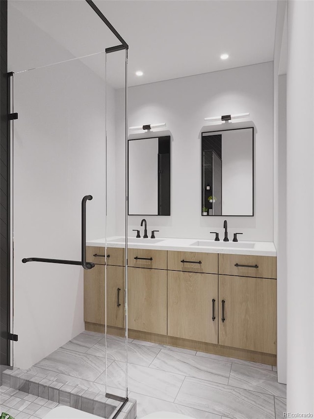 bathroom with vanity and an enclosed shower