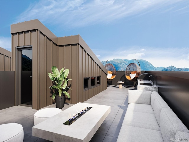 view of patio / terrace with an outdoor hangout area and a mountain view