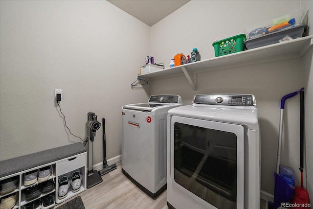 8908 Birch Run Ln, Parker, CO 80134 - laundry room featuring washer and dryer and light wood finished floors