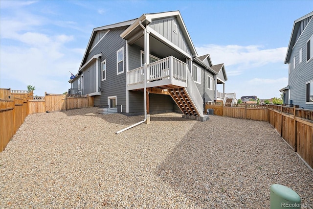 8908 Birch Run Ln, Parker, CO 80134 - back of property featuring board and batten siding, stairway, a wooden deck, and a fenced backyard