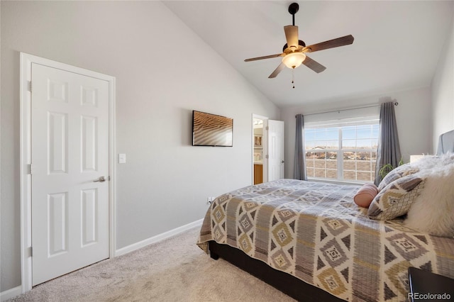 carpeted bedroom featuring lofted ceiling, baseboards, and a ceiling fan