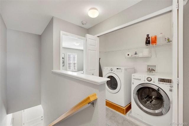 laundry room featuring laundry area and washer and clothes dryer