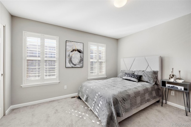 bedroom with carpet flooring and baseboards