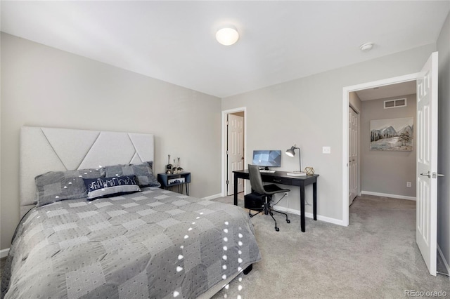 bedroom with carpet floors, baseboards, and visible vents