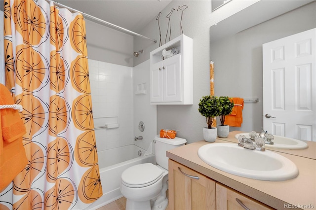 bathroom featuring shower / tub combo, vanity, and toilet