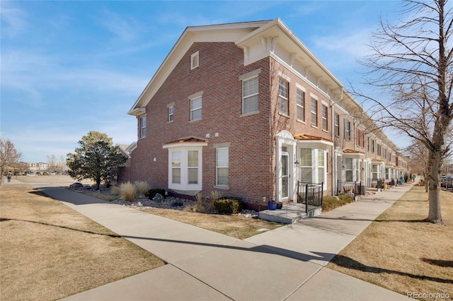 view of home's exterior with brick siding