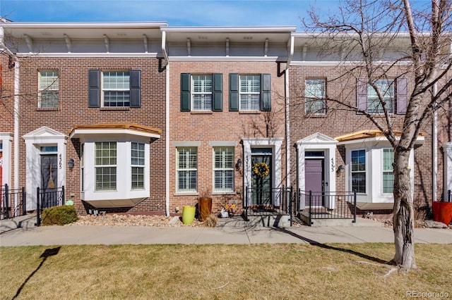 4357 W 118th Pl, Westminster, CO 80031 - view of front of house featuring brick siding and a front yard