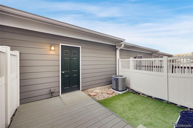 4357 W 118th Pl, Westminster, CO 80031 - entrance to property featuring central air condition unit, a deck, and fence