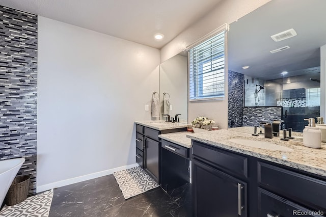10991 Xanadu St, Commerce City, CO 80022 - bathroom with vanity, a shower stall, marble finish flooring, and a soaking tub