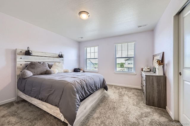 10991 Xanadu St, Commerce City, CO 80022 - bedroom featuring light colored carpet and a textured ceiling