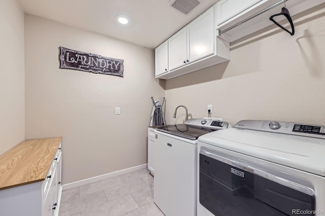 10991 Xanadu St, Commerce City, CO 80022 - washroom featuring washing machine and dryer and cabinet space