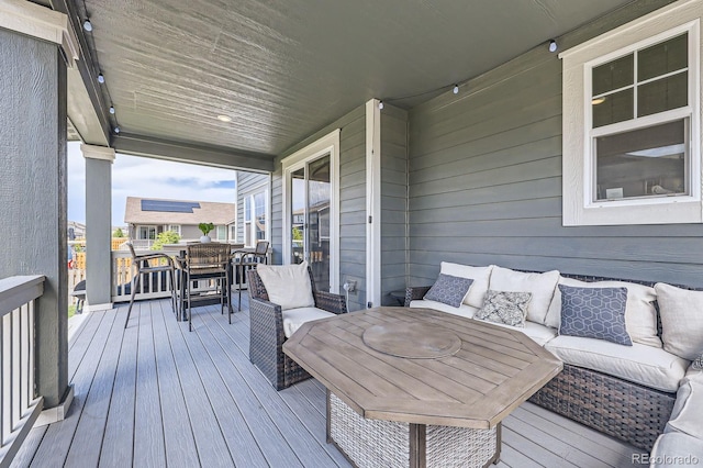 10991 Xanadu St, Commerce City, CO 80022 - deck featuring an outdoor living space