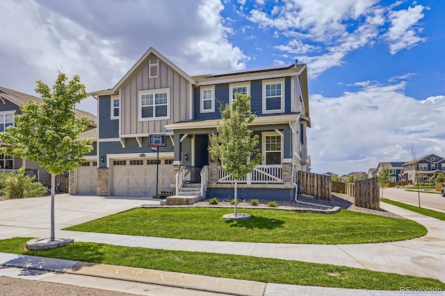 10991 Xanadu St, Commerce City, CO 80022 - view of front facade with stone siding, board and batten siding, solar panels, a porch, and driveway