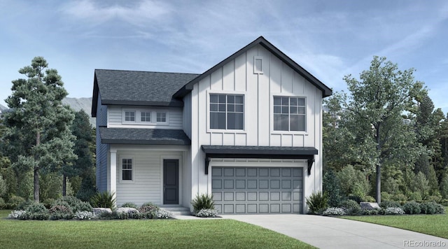 view of front of property featuring a garage and a front lawn