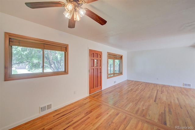 6054 Iris Way, Arvada, CO 80004 - spare room featuring light wood-style flooring and ceiling fan
