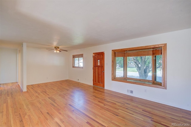 6054 Iris Way, Arvada, CO 80004 - unfurnished room with light wood finished floors and ceiling fan