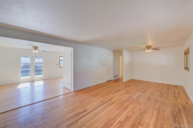 6054 Iris Way, Arvada, CO 80004 - empty room featuring a ceiling fan and light wood-style flooring