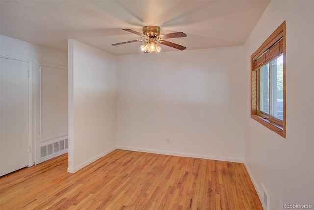 6054 Iris Way, Arvada, CO 80004 - empty room with light wood finished floors and a ceiling fan
