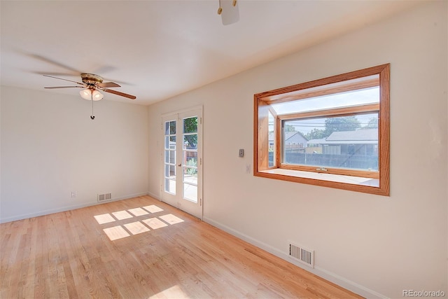 6054 Iris Way, Arvada, CO 80004 - spare room with ceiling fan and light wood-style flooring