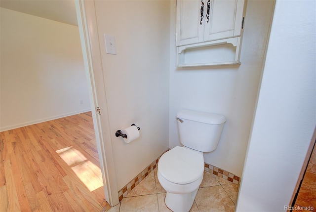 6054 Iris Way, Arvada, CO 80004 - bathroom featuring toilet and wood finished floors