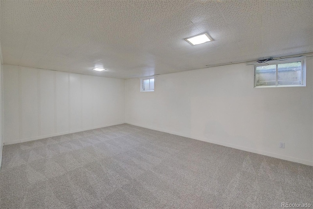 6054 Iris Way, Arvada, CO 80004 - below grade area featuring carpet and baseboards